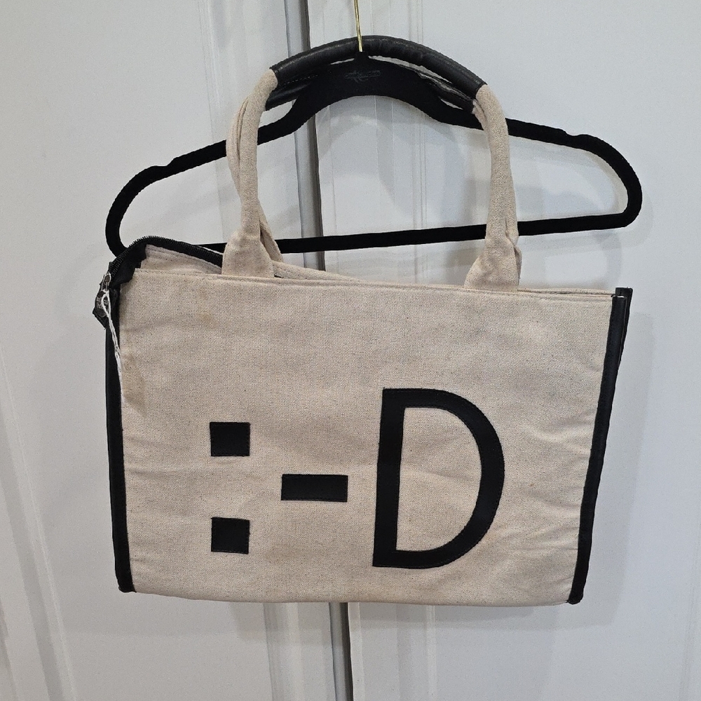 Stylish Beige Tote Bag with Black Accents
